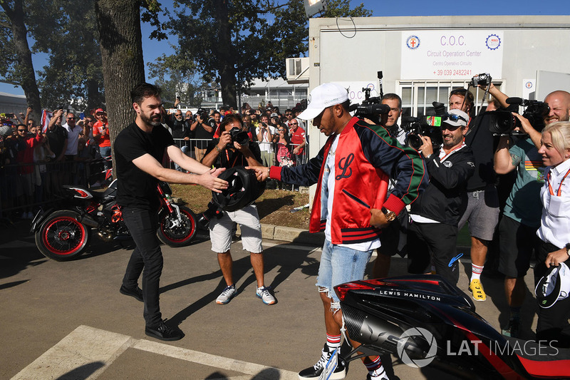 Lewis Hamilton, Mercedes AMG F1 arrives at the track on his motorbike