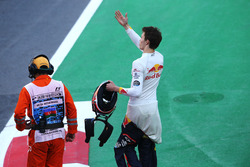 Daniil Kvyat, Scuderia Toro Rosso, waves to fans in the crowd after retiring from the race