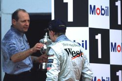 Mika Hakkinen and Ron Dennis celebrate Mika's first win