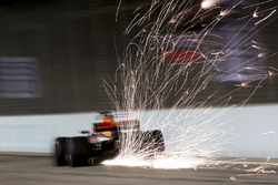 Sparks pour from the rear of Daniel Ricciardo, Red Bull Racing RB13