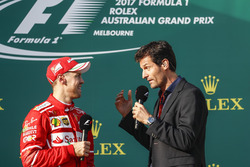 Sebastian Vettel, Ferrari, 1st Position, is interviewed by Mark Webber on the podium