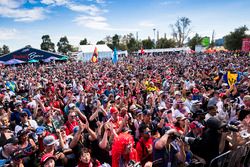 Fans watch drivers being interviewed on stage