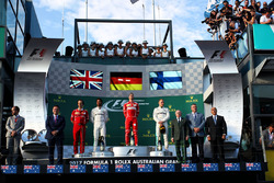 Podium: winner Sebastian Vettel, Ferrari, second place Lewis Hamilton, Mercedes AMG F1, third place Valtteri Bottas, Mercedes AMG F1