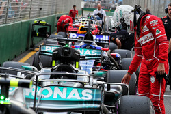 Sebastian Vettel, Ferrari looks at the Mercedes AMG F1 W08 in qualifying parc ferme