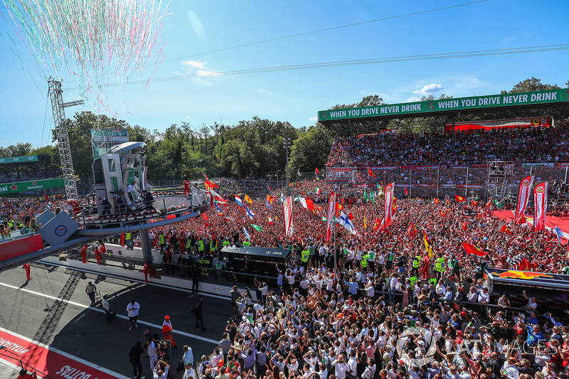 Sebastian Vettel, Ferrari, Lewis Hamilton, Mercedes AMG F1 and Valtteri Bottas, Mercedes AMG F1 celebrate on the podium and Ferrari Fans and flags at the podium celebrations
