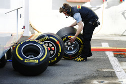 A Pirelli technician examines tyres