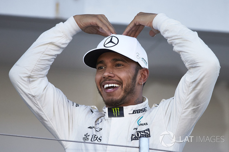 Race winner Lewis Hamilton, Mercedes AMG F1, does the Mobot on the podium