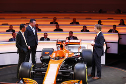 Yusuke Hasegawa, Senior Managing Officer, Honda, Eric Boullier, Racing Director, McLaren, and presenter Simon Lazenby stand on stage next to the MCL32