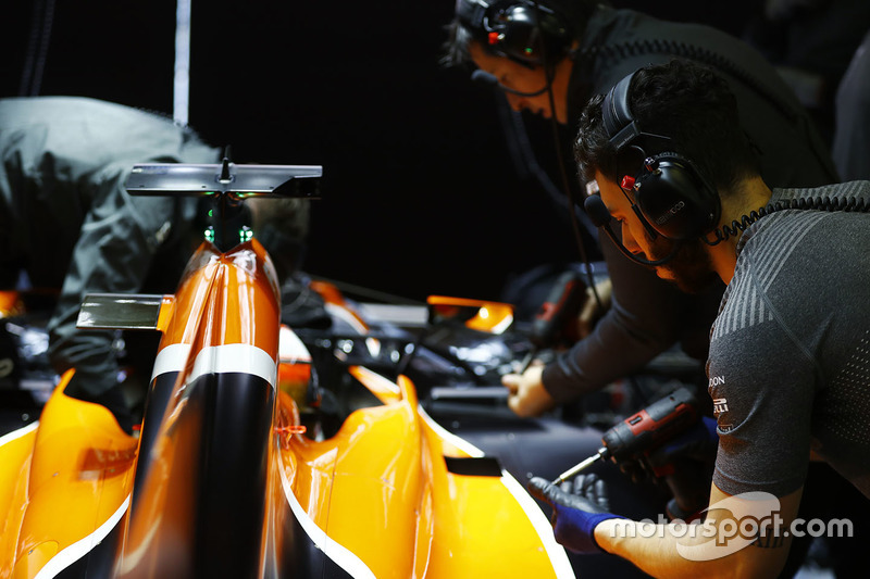 Mechanics at work on the McLaren MCL32