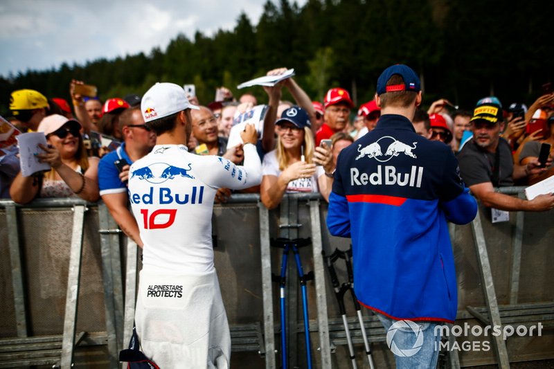 Pierre Gasly, Toro Rosso, and Daniil Kvyat, Toro Rosso sign autographs for fans
