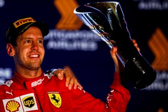Race winner Sebastian Vettel, Ferrari celebrates on the podium with the trophy
