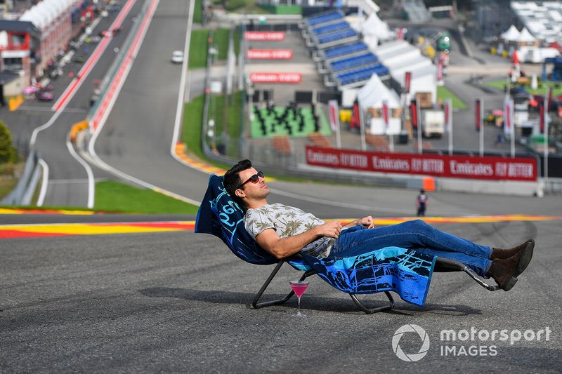 Steve Jones, Channel 4 presenter, relaxes on a sun-lounger at Eau Rouge