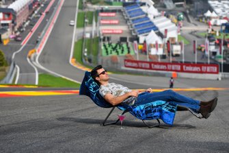 Steve Jones, Channel 4 presenter, relaxes on a sun-lounger at Eau Rouge