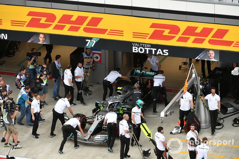 Valtteri Bottas, Mercedes AMG W10, is returned to the garage