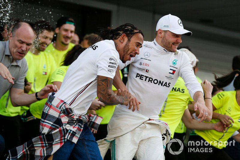 Valtteri Bottas, Mercedes AMG F1, 2nd position, Lewis Hamilton, Mercedes AMG F1, 1st position, and the Mercedes team celebrate a perfect result