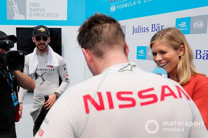 Jean-Eric Vergne, DS TECHEETAH, looks on as Oliver Rowland, Nissan e.Dams, is interviewed by TV Presenter Nicki Shields 