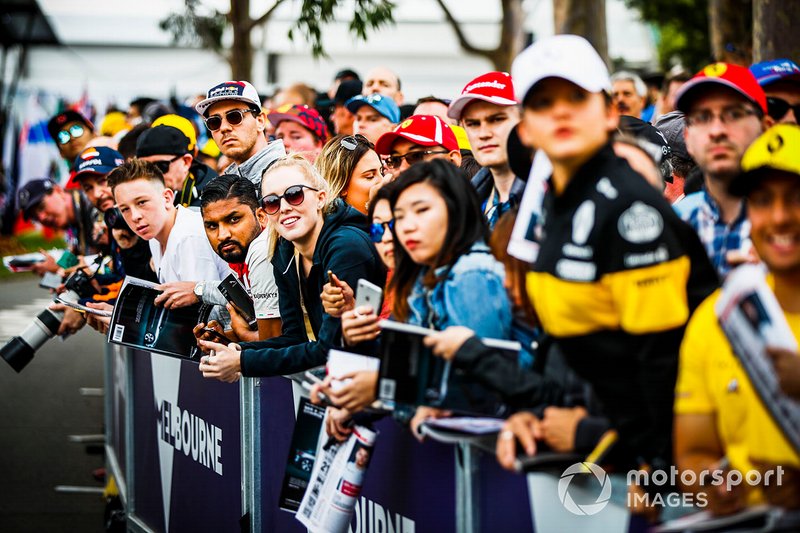 Fans wait for autographs from the drivers