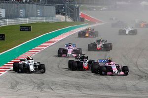 Esteban Ocon, Racing Point Force India VJM11, Charles Leclerc, Sauber C37 and Romain Grosjean, Haas F1 Team VF-18 battle 