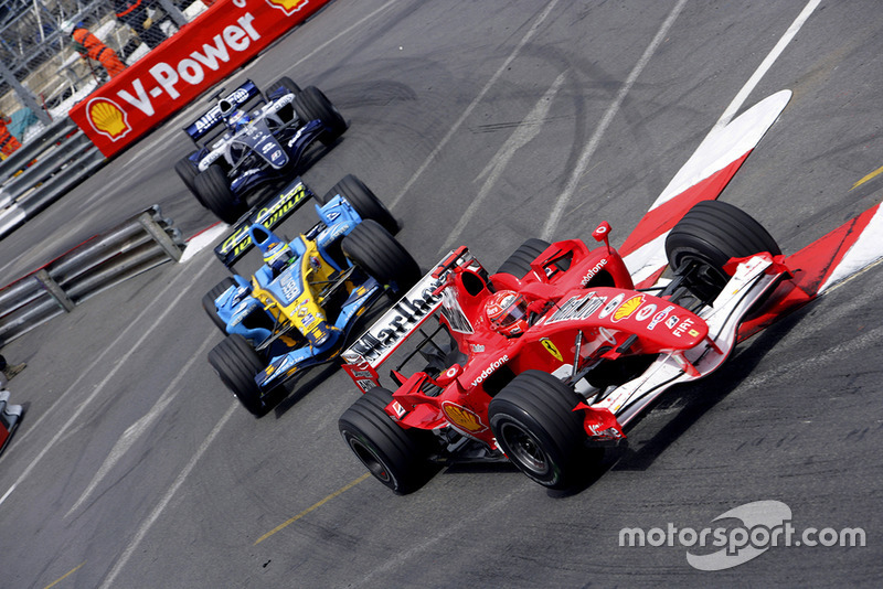 Michael Schumacher, Ferrari 248F1, Giancarlo Fisichella, Renault R26