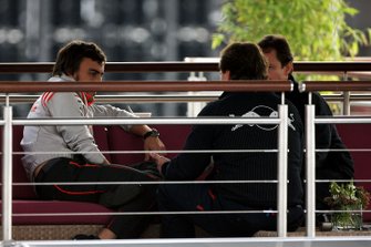 Fernando Alonso, McLaren talks with Christian Horner, Red Bull Racing Sporting Director in the Red Bull Energy Station