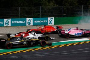 Sebastian Vettel, Ferrari SF71H lighting up his tyres after making contact with Lewis Hamilton, Mercedes AMG F1 W09 while Sergio Perez, Racing Point Force India VJM11,Charles Leclerc, Alfa Romeo Sauber C37 and Nico Hulkenberg, Renault Sport F1 Team R.S. 18 drive past 