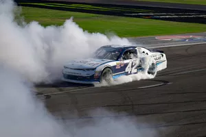 Ross Chastain, Chip Ganassi Racing, Chevrolet Camaro DC Solar celebrates with a burnout after winning 