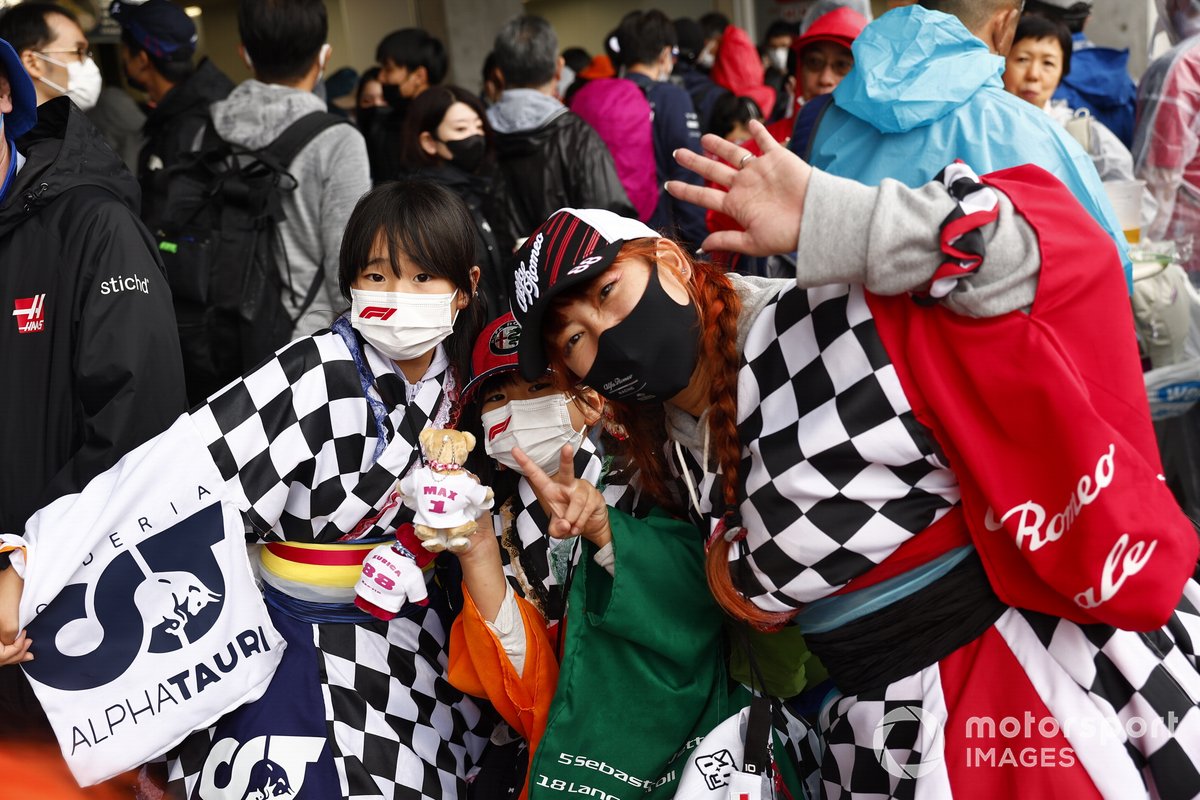 Fans in chequered flag outfits