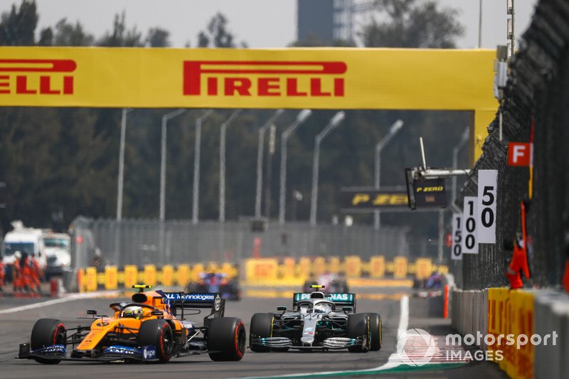 Lando Norris, McLaren MCL34, leads Valtteri Bottas, Mercedes AMG W10