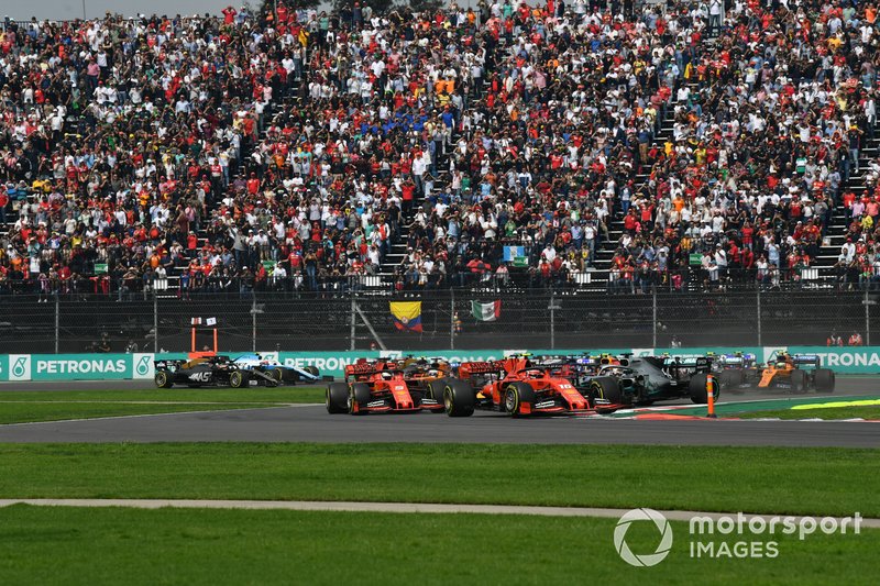 Charles Leclerc, Ferrari SF90, leads Sebastian Vettel, Ferrari SF90, Alexander Albon, Red Bull RB15, Lewis Hamilton, Mercedes AMG F1 W10, Max Verstappen, Red Bull Racing RB15, and the rest of the field at the start