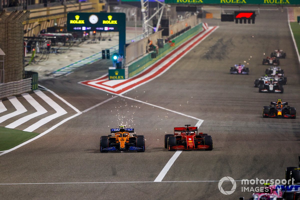 Lando Norris, McLaren MCL35, Sebastian Vettel, Ferrari SF1000