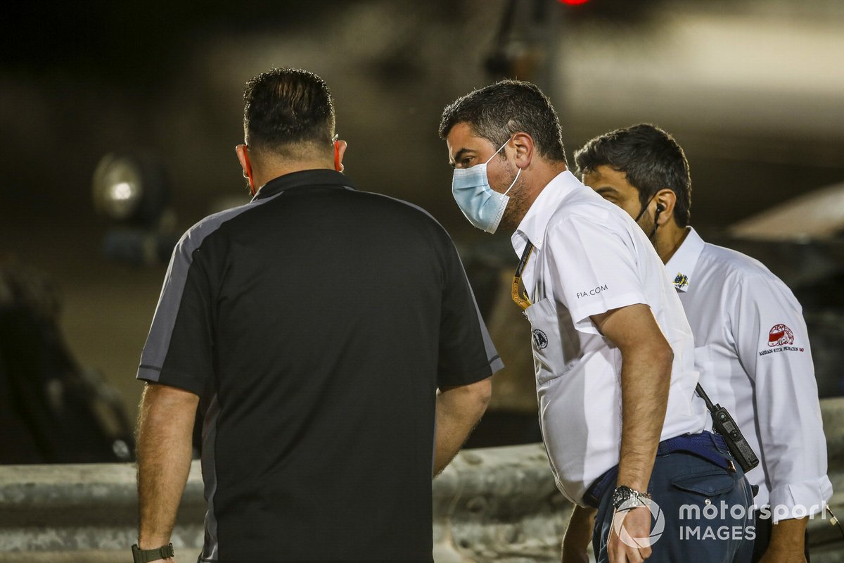 Michael Masi, Race Director, FIA, attends the scene of the huge crash for Romain Grosjean, Haas VF-20