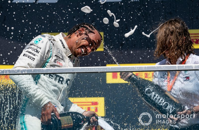 Lewis Hamilton, Mercedes AMG F1, 1st position, sprays Champagne on the podium