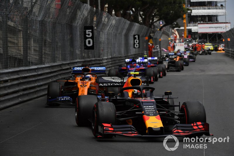 Pierre Gasly, Red Bull Racing RB15, leads Carlos Sainz Jr., McLaren MCL34, Daniil Kvyat, Toro Rosso STR14, and Alexander Albon, Toro Rosso STR14