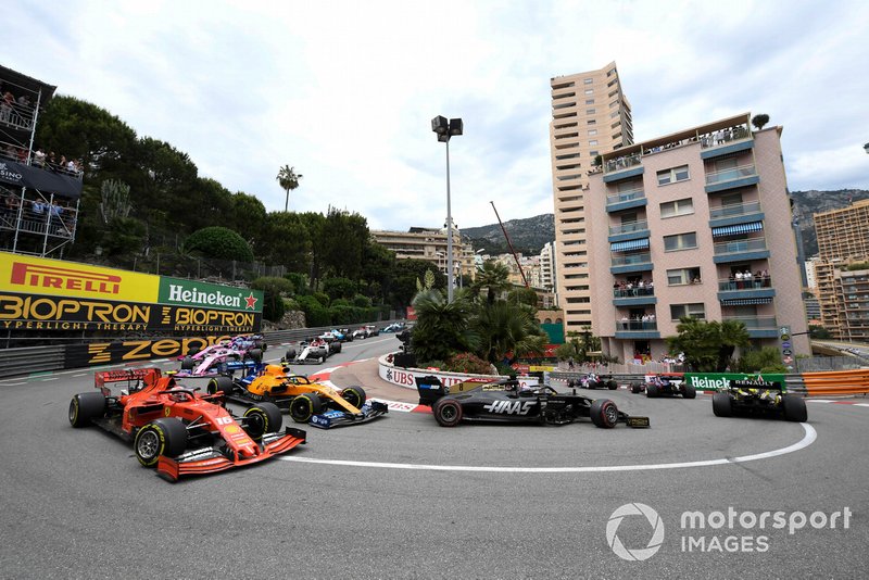 Romain Grosjean, Haas F1 Team VF-19, leads Charles Leclerc, Ferrari SF90, Lando Norris, McLaren MCL34, and Lance Stroll, Racing Point RP19