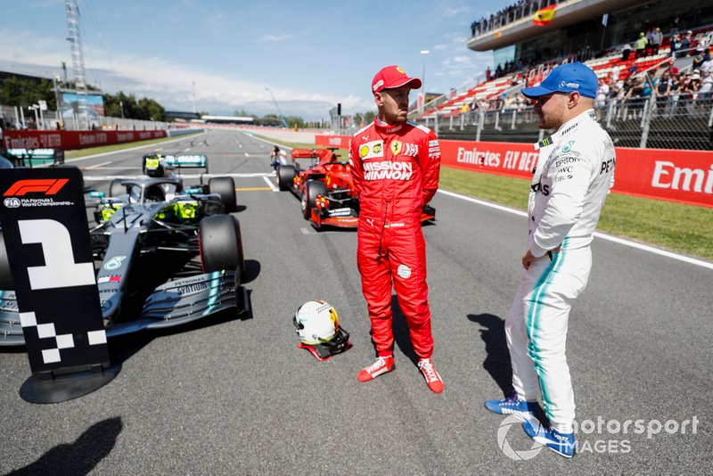 Sebastian Vettel, Ferrari and Pole Sitter Valtteri Bottas, Mercedes AMG F1 talk in Parc Ferme