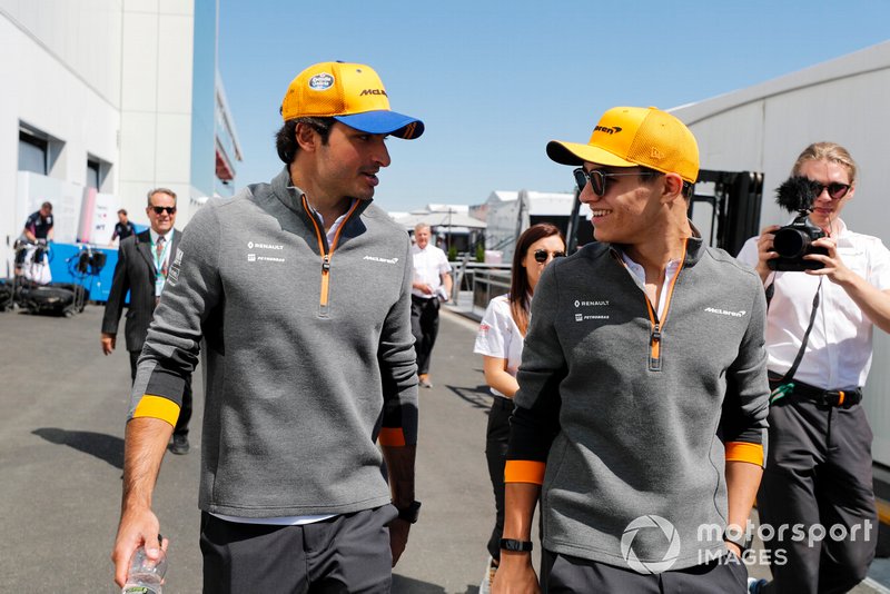 Carlos Sainz Jr., McLaren and Lando Norris, McLaren in the paddock 