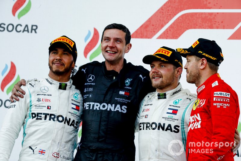 Lewis Hamilton, Mercedes AMG F1, the Mercedes Constructors trophy delegate, Valtteri Bottas, Mercedes AMG F1, 1st position, and Sebastian Vettel, Ferrari, 3rd position, on the podium