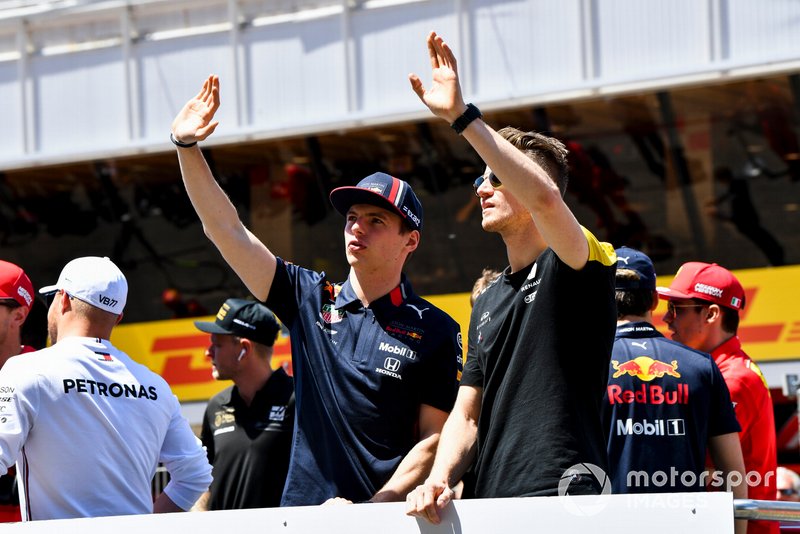 Max Verstappen, Red Bull Racing, and Nico Hulkenberg, Renault F1 Team, wave to fans at the drivers parade