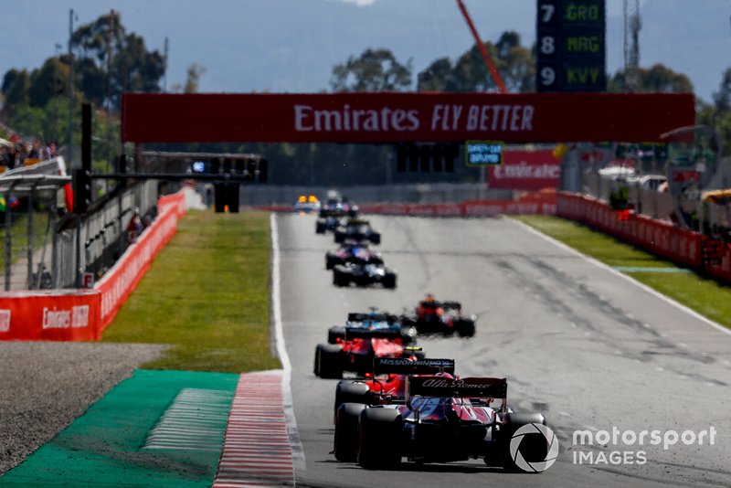 Charles Leclerc, Ferrari SF90, leads Kimi Raikkonen, Alfa Romeo Racing C38