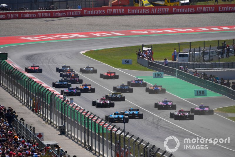 Valtteri Bottas, Mercedes AMG W10, Lewis Hamilton, Mercedes AMG F1 W10, and Sebastian Vettel, Ferrari SF90, lead the field toward the first corner at the start