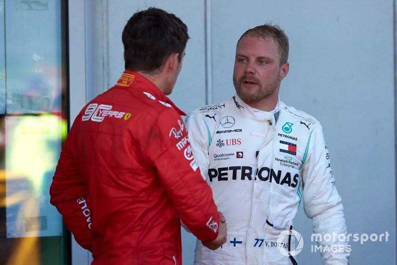 Charles Leclerc, Ferrari, seconda posizione, and Valtteri Bottas, Mercedes AMG F1, terza posizione, al Parc Ferme