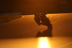 Track action at sunset