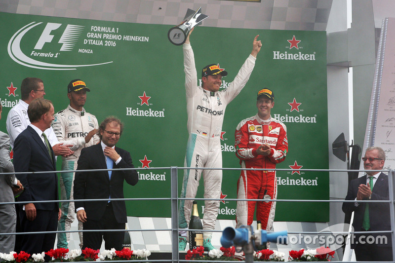 The podium (L to R): second place Lewis Hamilton, Mercedes AMG F1; Race winner Nico Rosberg, Mercede