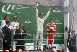 The podium (L to R): second place Lewis Hamilton, Mercedes AMG F1; Race winner Nico Rosberg, Mercedes AMG F1; third place Sebastian Vettel, Ferrari