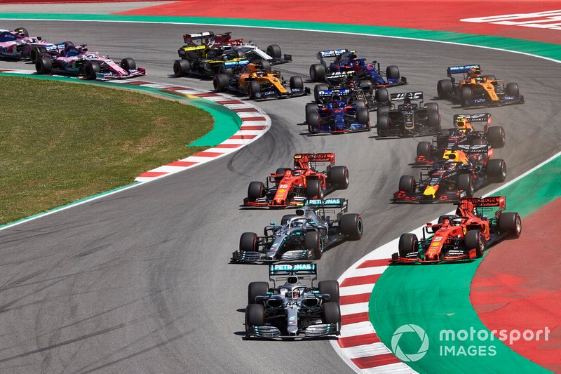 Lewis Hamilton, Mercedes AMG F1 W10, leads Valtteri Bottas, Mercedes AMG W10, Sebastian Vettel, Ferrari SF90,Max Verstappen, Red Bull Racing RB15, Charles Leclerc, Ferrari SF90, and the rest of the field in the first corner