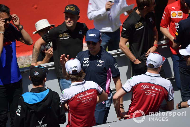 Lance Stroll, Racing Point, greets Antonio Giovinazzi, Alfa Romeo Racing, at the drivers parade