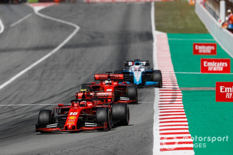 Charles Leclerc, Ferrari SF90, leads Sebastian Vettel, Ferrari SF90, and George Russell, Williams Racing FW42