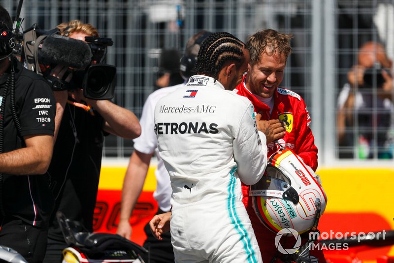 Lewis Hamilton, Mercedes AMG F1, and pole man Sebastian Vettel, Ferrari, after Qualifying