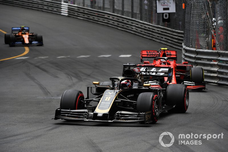Romain Grosjean, Haas F1 Team VF-19, leads Charles Leclerc, Ferrari SF90, and Lando Norris, McLaren MCL34