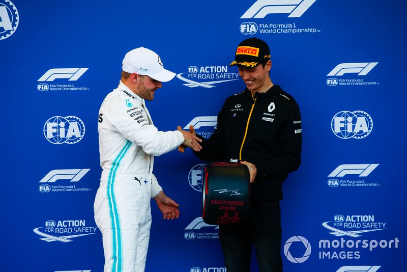 Pole man Valtteri Bottas, Mercedes AMG F1, receives his Pirelli Pole Position award from Jack Aitken, Development Driver, Renault F1